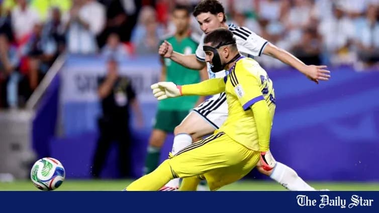Goalkeeper in yellow jersey making a save