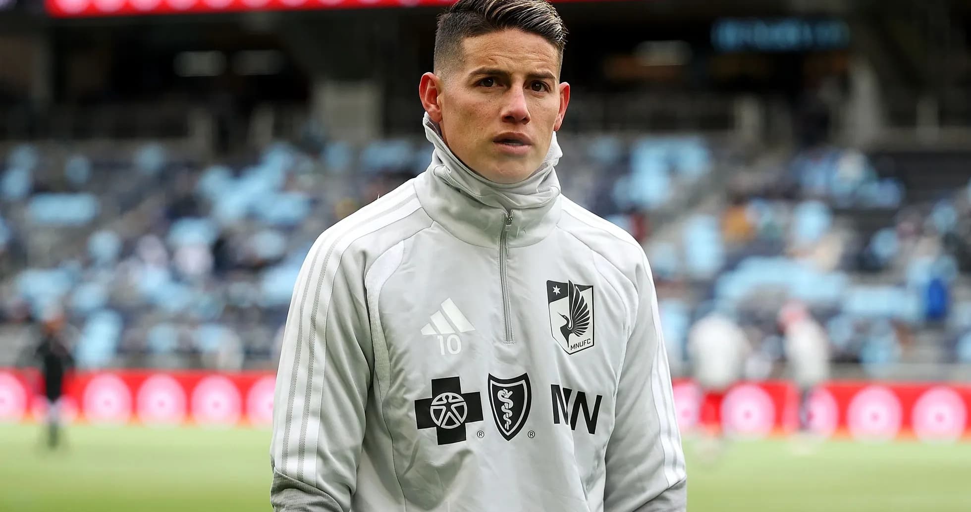 Player in warm-up gear at stadium before match