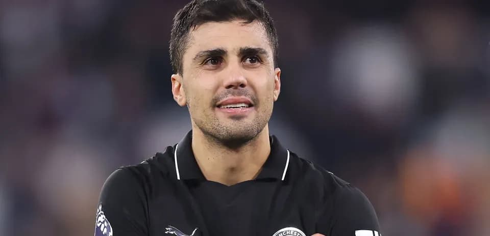 Player in black jersey celebrating on the field