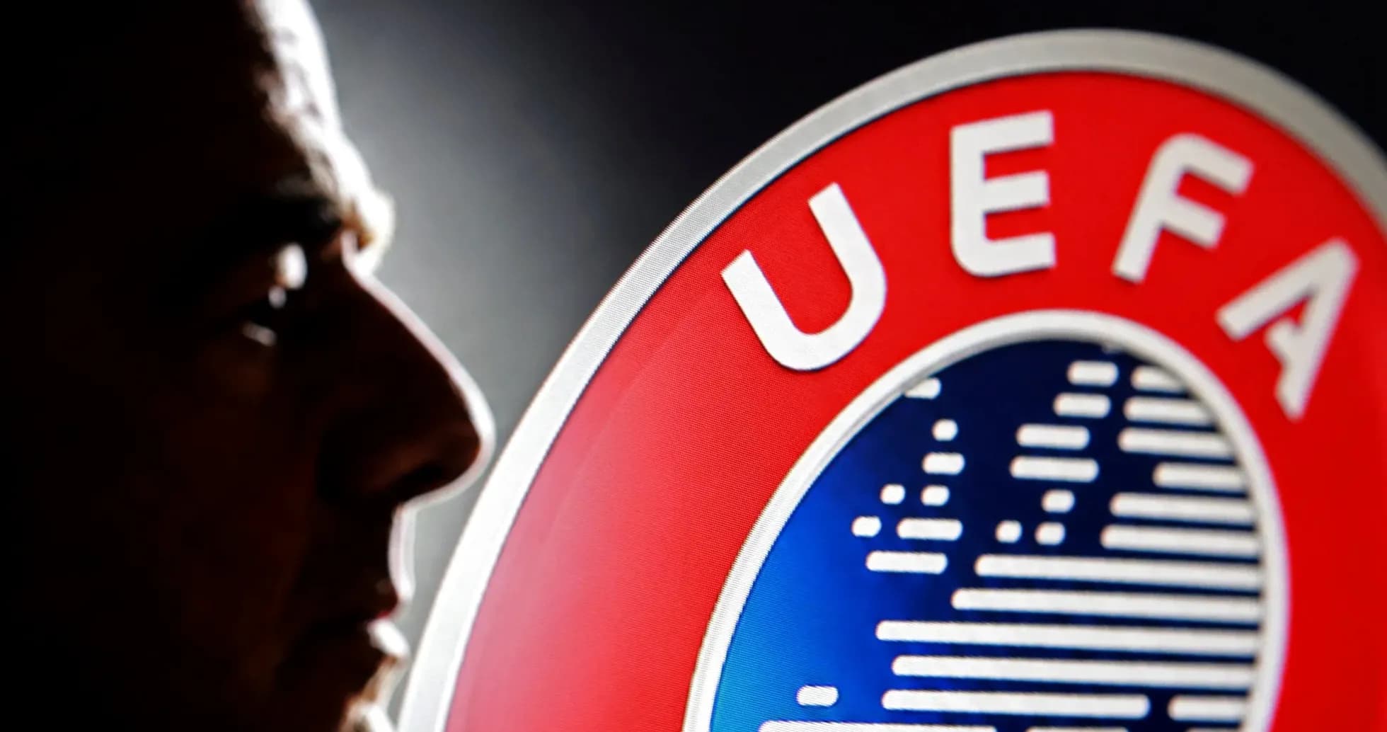 Profile of a man next to UEFA logo