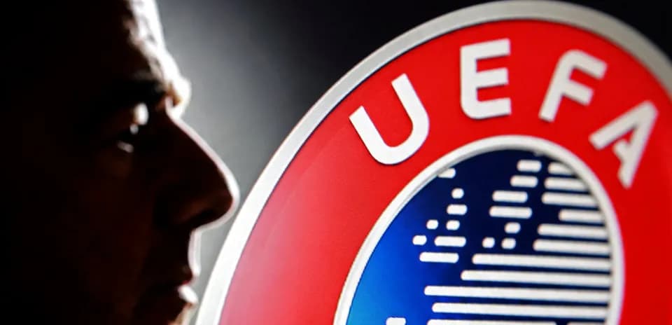 Profile of a man next to UEFA logo