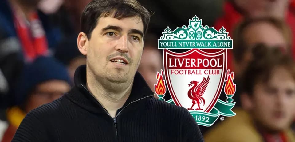 Man observing match with Liverpool logo in background