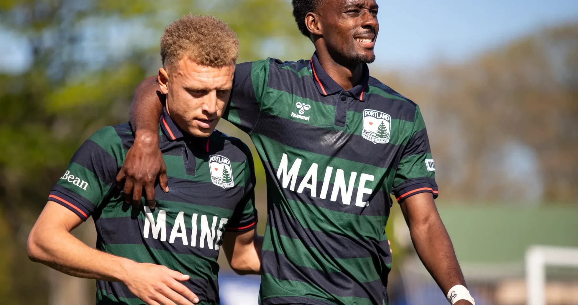 Portland Hearts of Pine players celebrating on field