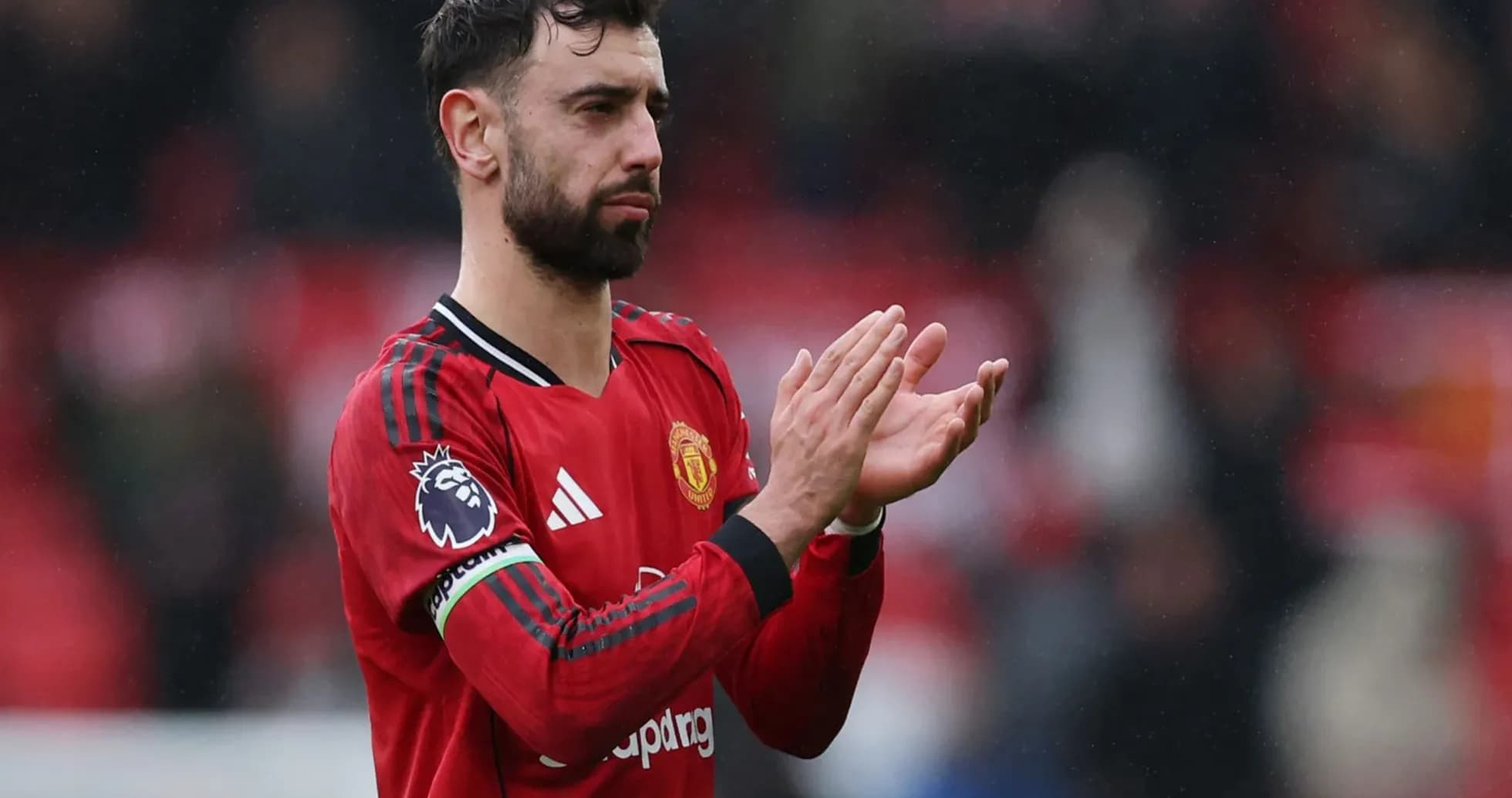 Bruno Fernandes applauding fans after match
