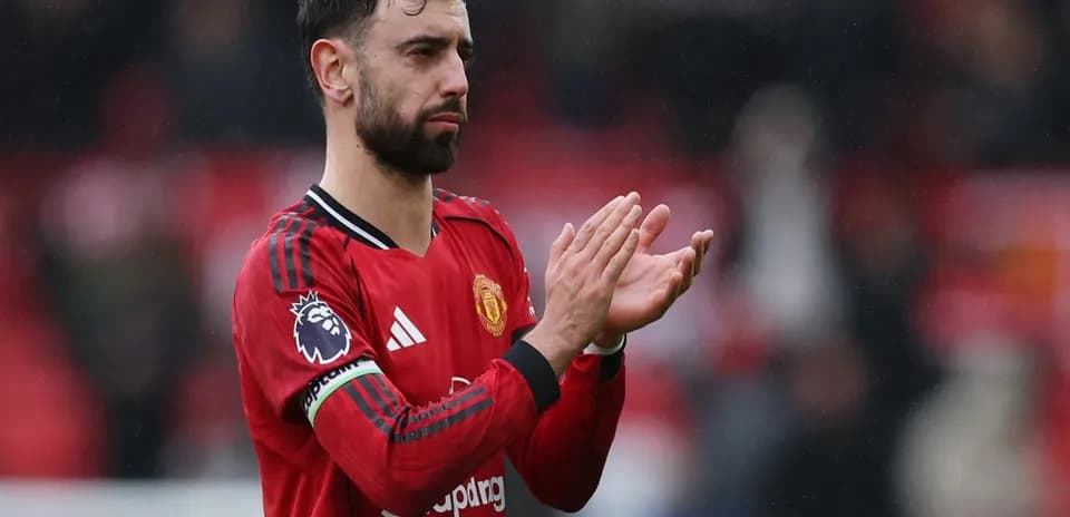 Bruno Fernandes applauding fans after match