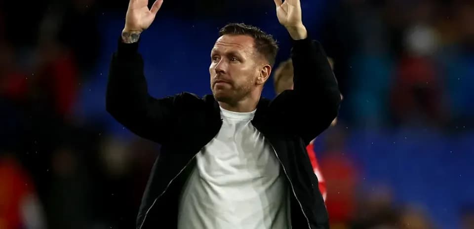 Person gesturing to crowd after match conclusion