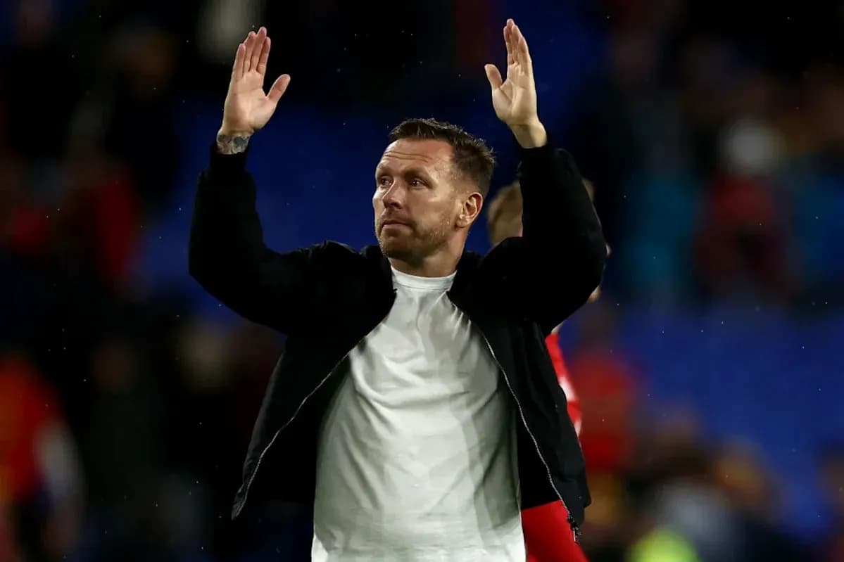 Person gesturing to crowd after match conclusion