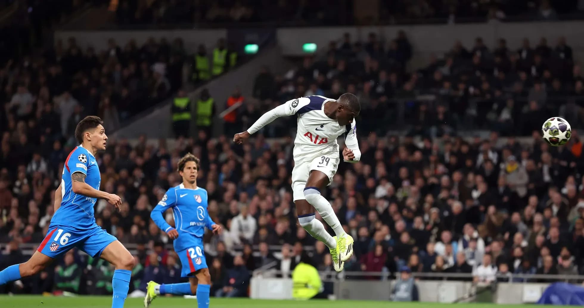 Player heading the ball during Champions League match