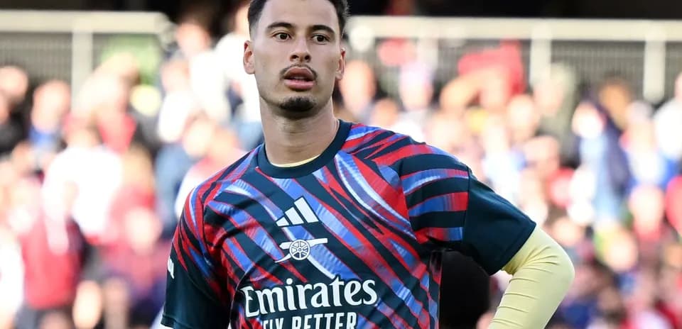 Goalkeeper in colorful kit during warm-up