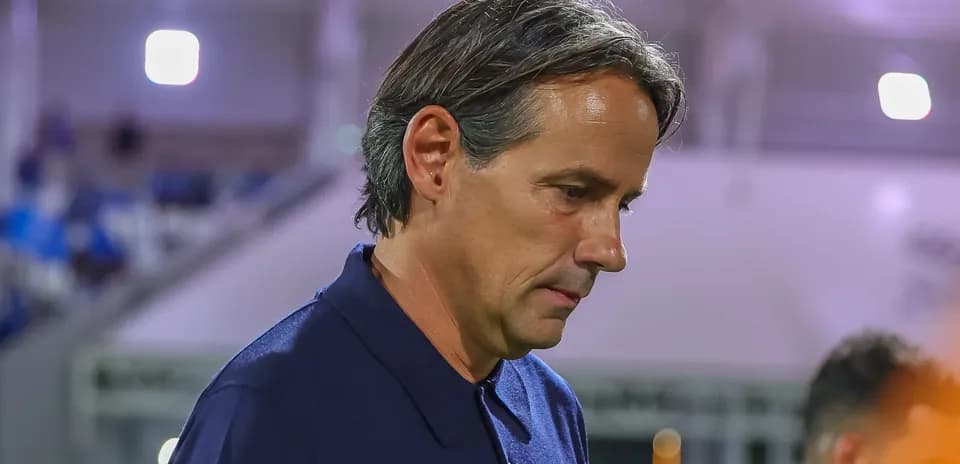 Coach walking off the field after match