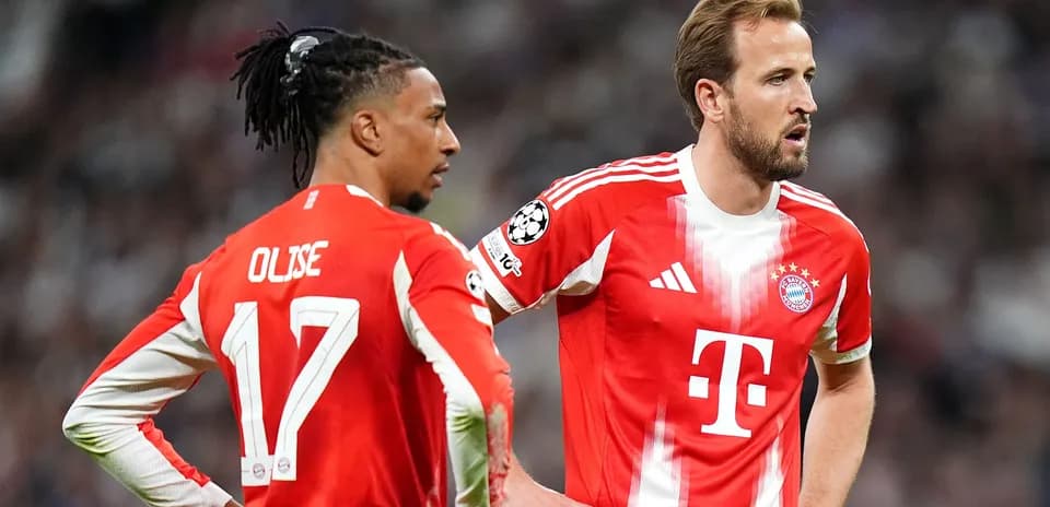 Two Bayern Munich players discussing during match