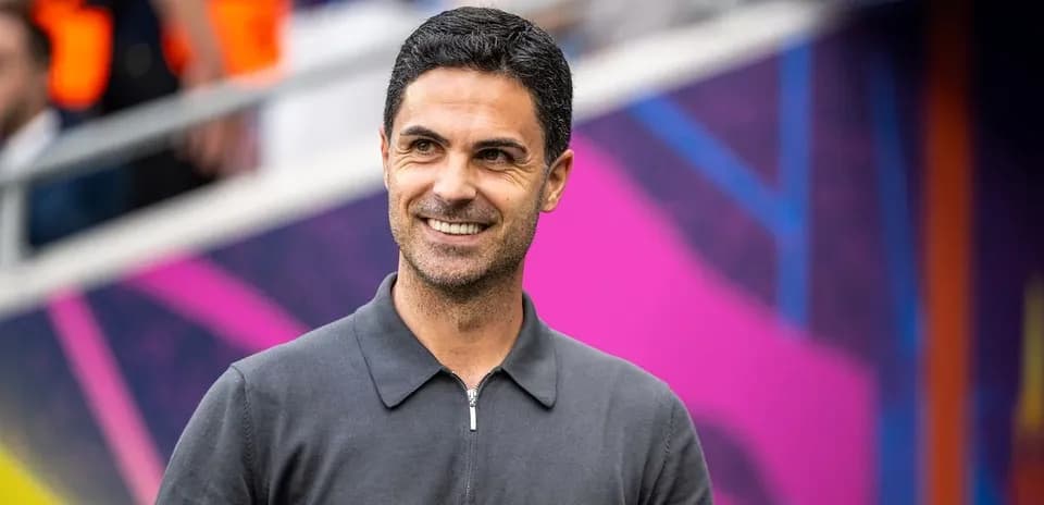 Coach smiling before the match in stadium