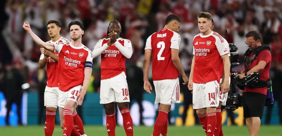 Arsenal players celebrating after a match victory