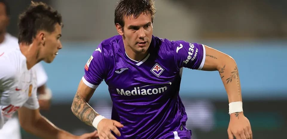 Player in purple jersey sprinting during match