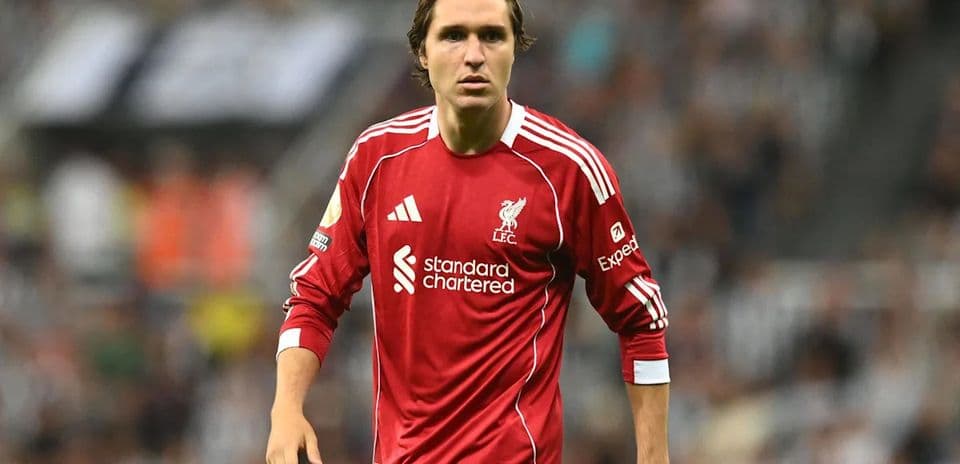 Player in red Liverpool kit on the field