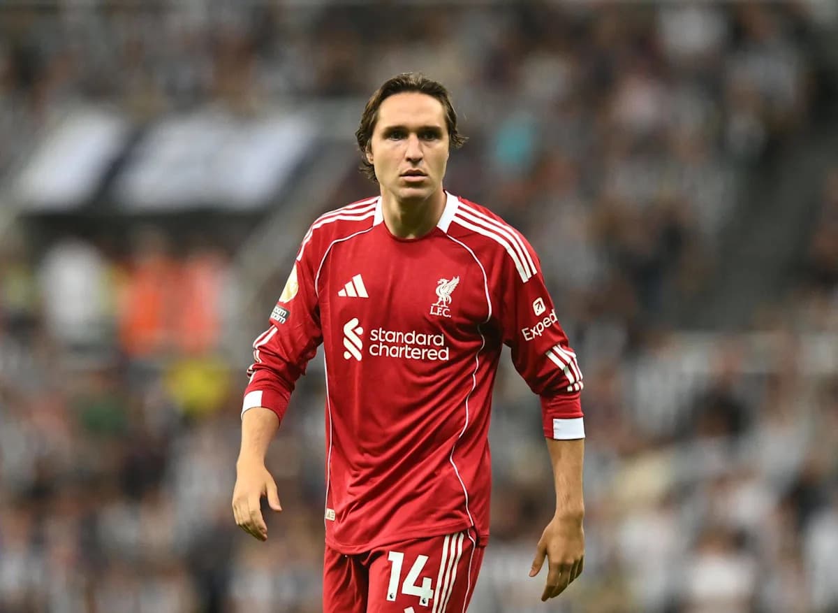 Player in red Liverpool kit on the field