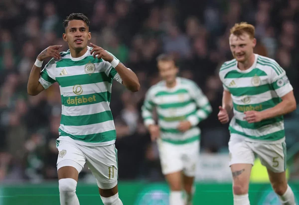 Celtic players celebrating a goal on the pitch