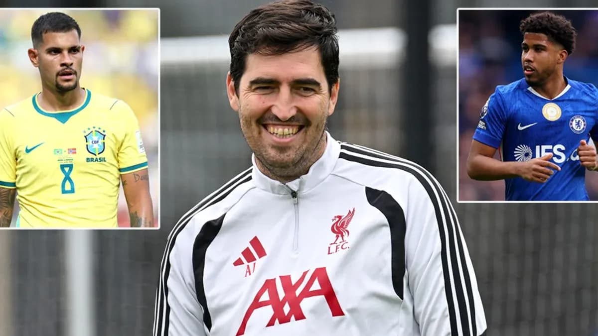 Liverpool coach smiling with players' images in background