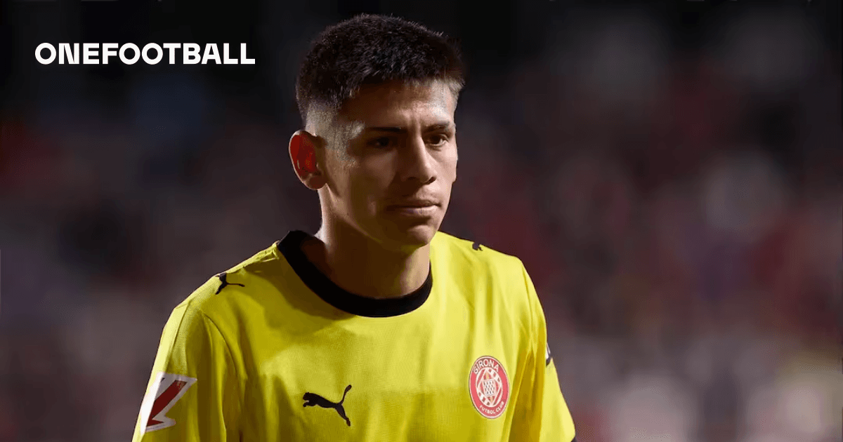 Goalkeeper in yellow jersey walking off the field