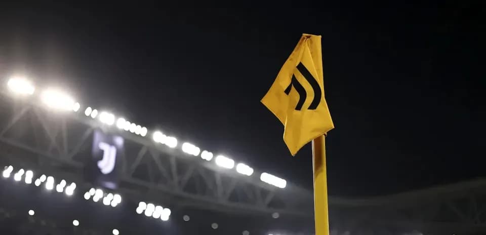 Corner flag at Juventus stadium under night lights