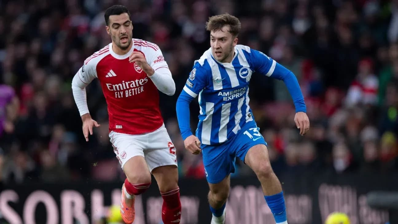 Arsenal player chasing Brighton player during match