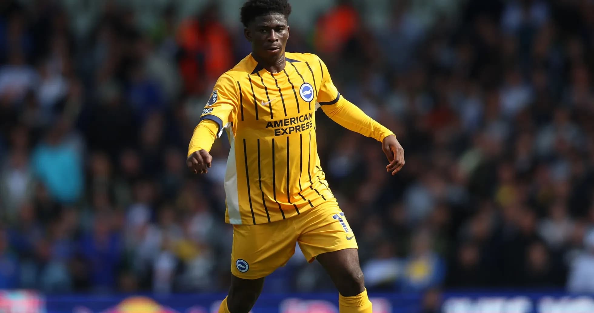 Player in yellow kit during football match