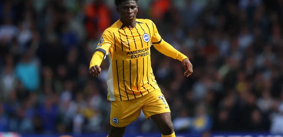 Player in yellow kit during football match