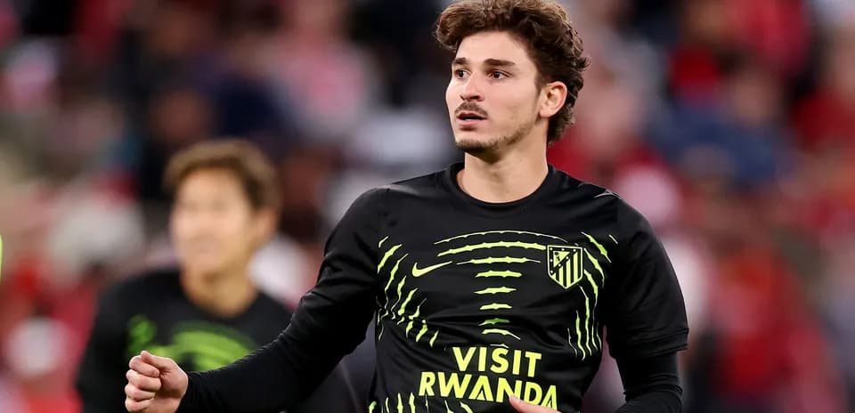 Player warming up in Atlético Madrid training kit