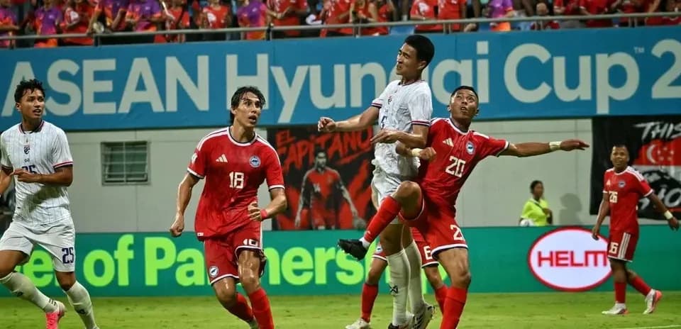 Players contesting a high ball during a match