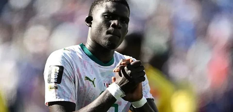 Player with clasped hands on the field