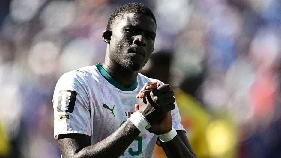 Player with clasped hands on the field