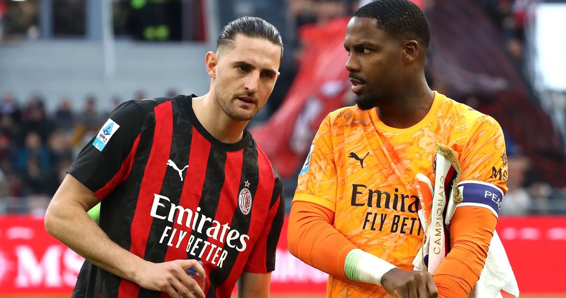 AC Milan players discussing on the pitch