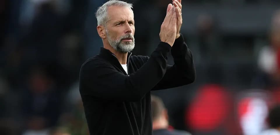 Coach applauding during match on the sidelines