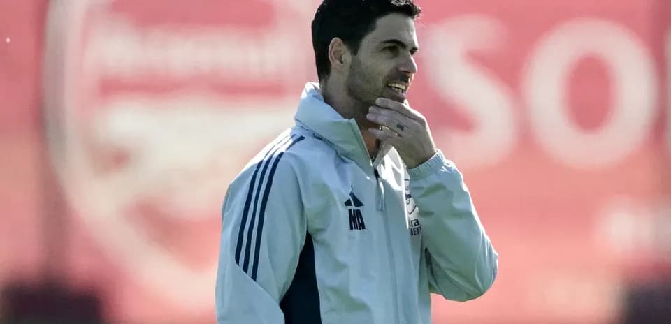 Manager observing training session at Arsenal facility
