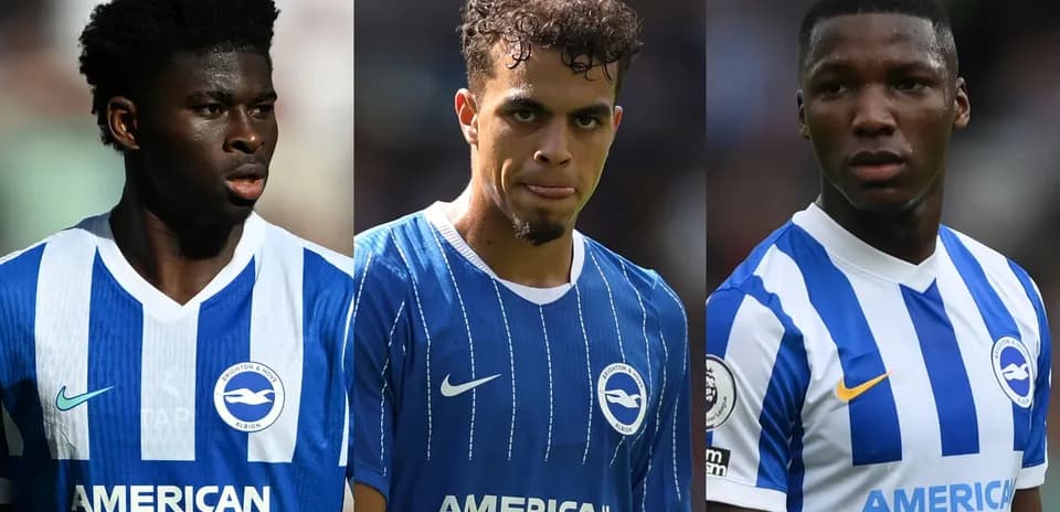 Three Brighton players in blue jerseys on pitch