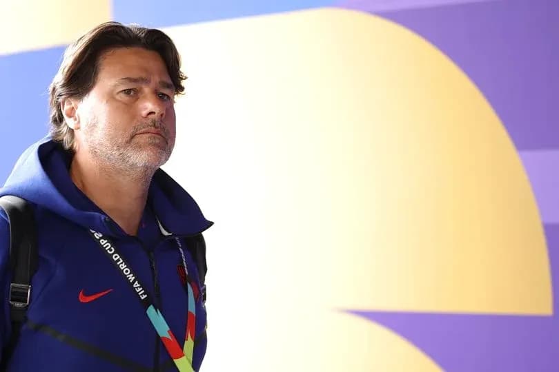 Coach walking in venue with FIFA World Cup credentials
