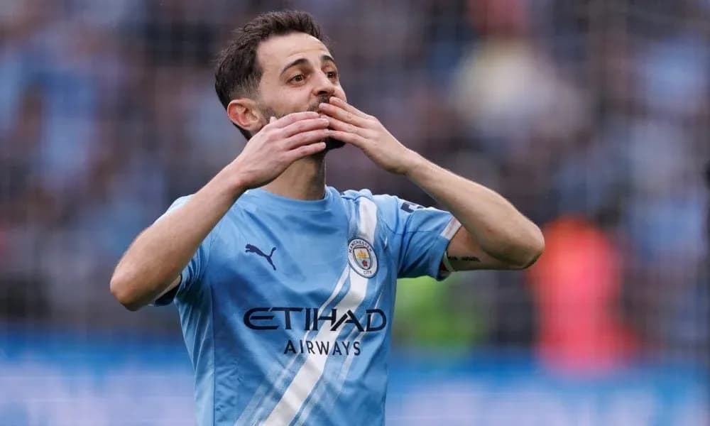 Player celebrating during match in Manchester City kit