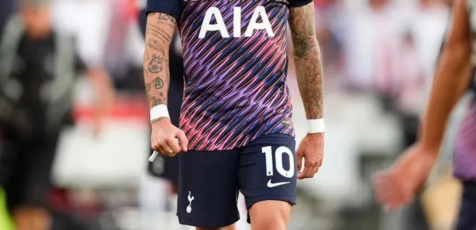 Player wearing Tottenham jersey on the field
