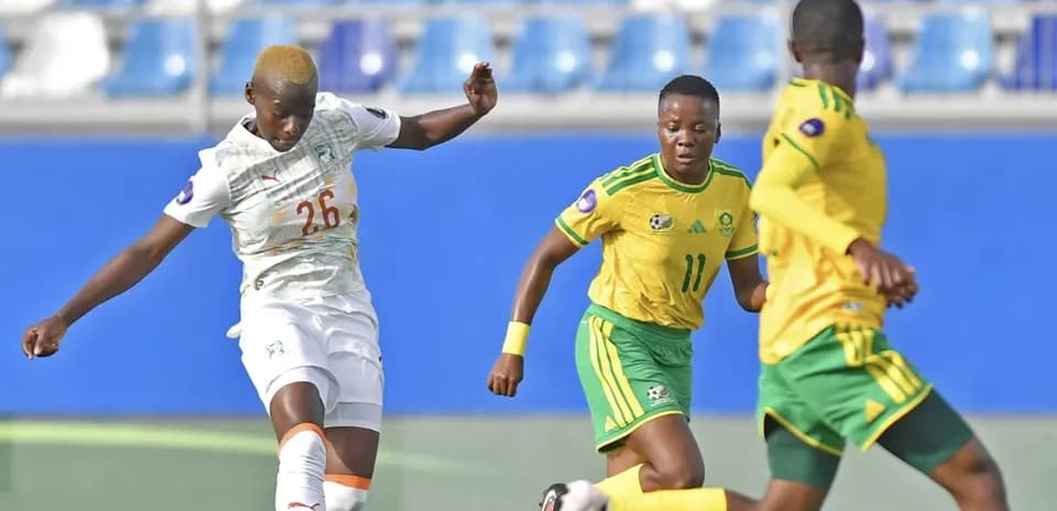 Player from Ivory Coast kicking ball against South Africa