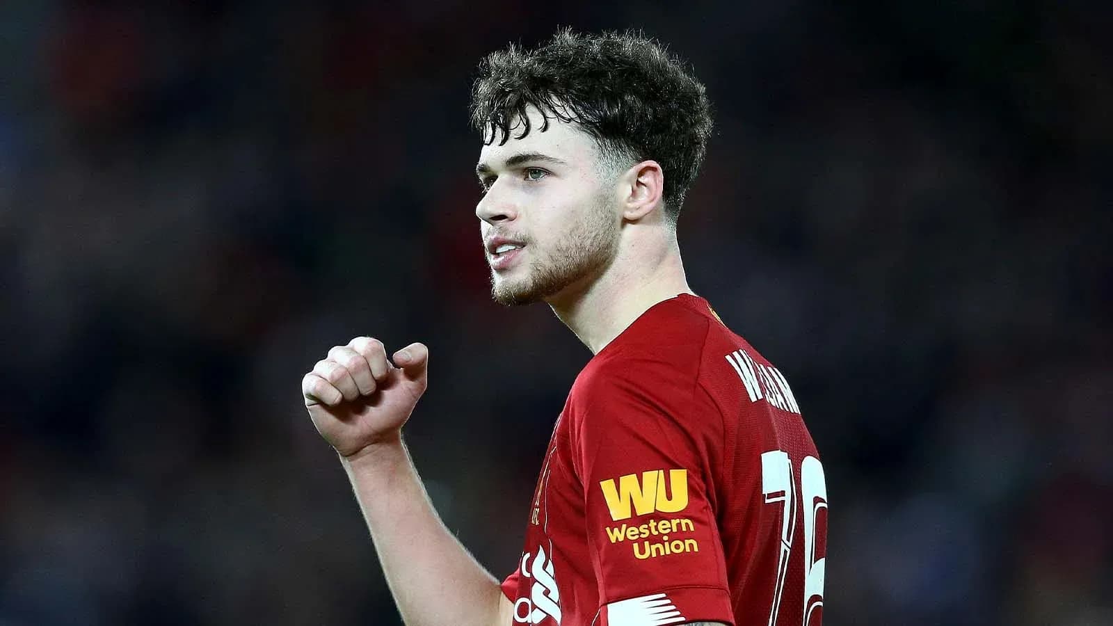 Player in red jersey celebrating during a match