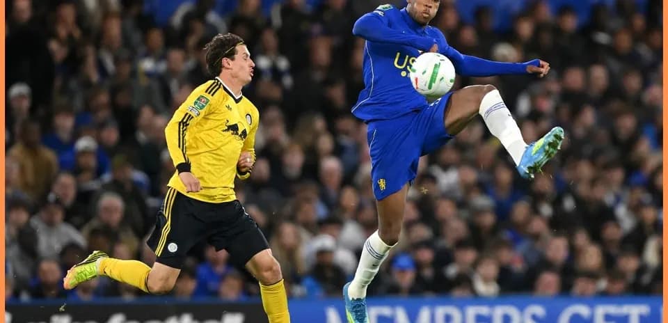 Player in blue controlling the ball during match