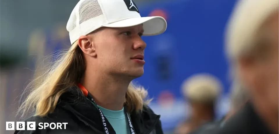 Person wearing a cap at sports event