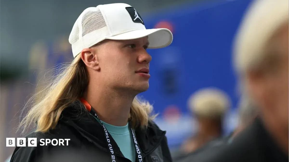 Person wearing a cap at sports event