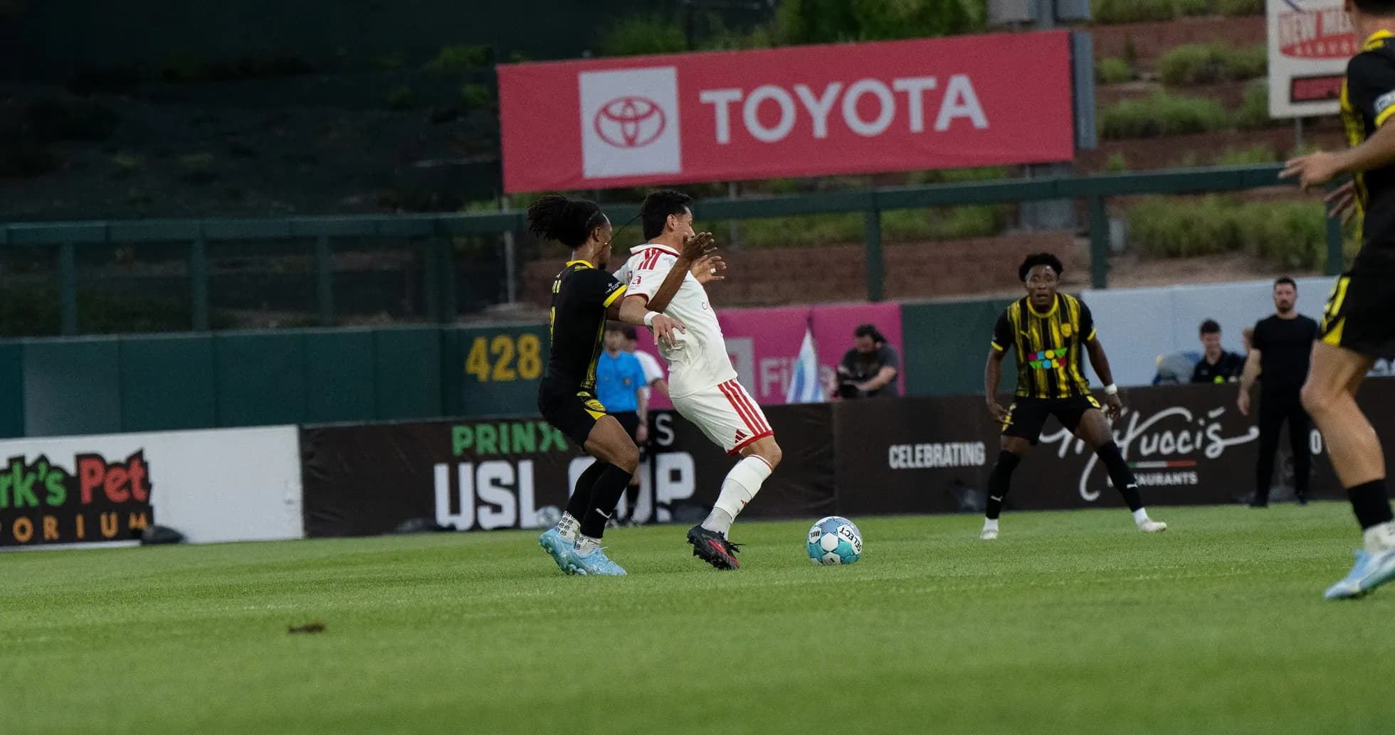 Player challenge during New Mexico United match