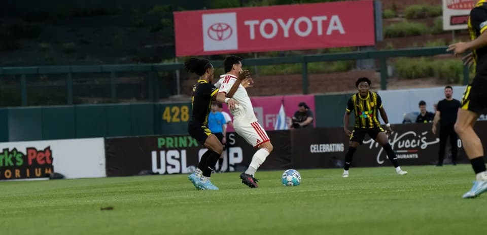 Player challenge during New Mexico United match