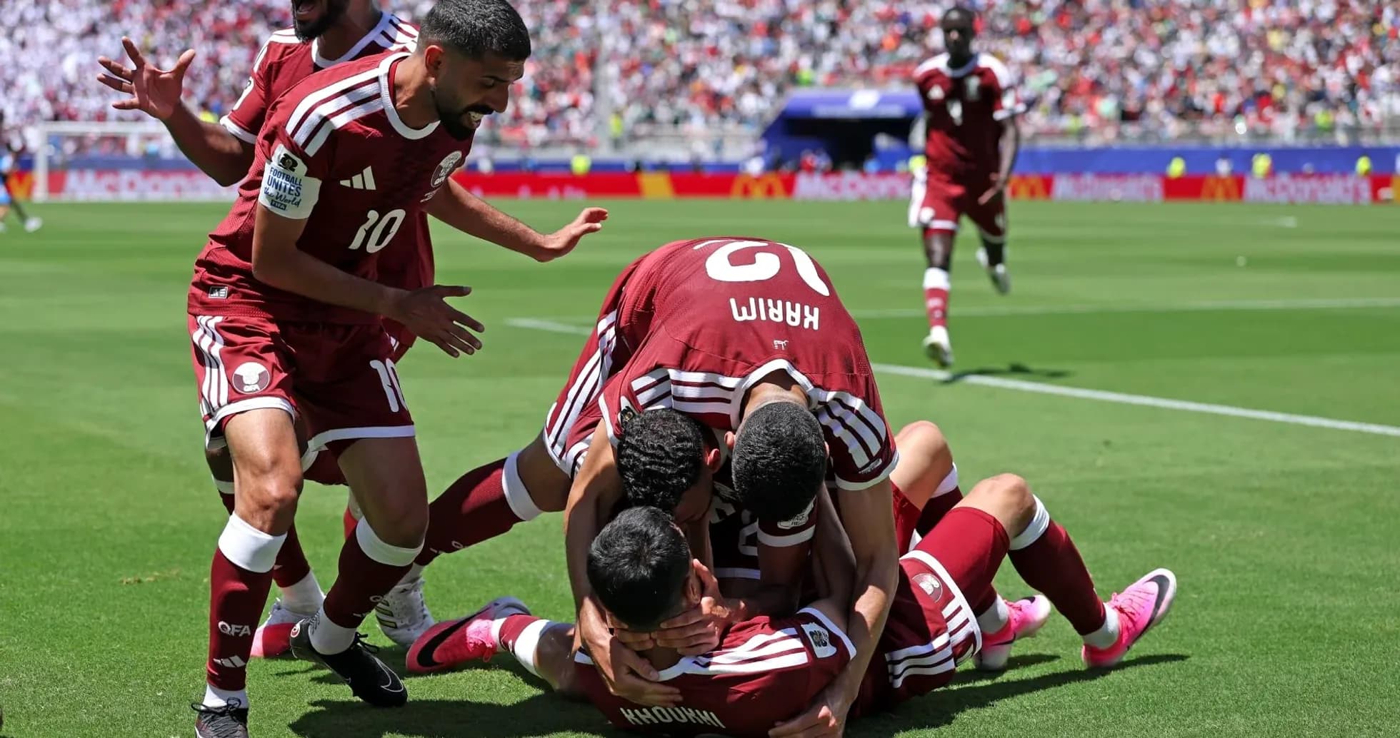 Qatar players celebrating a goal during match