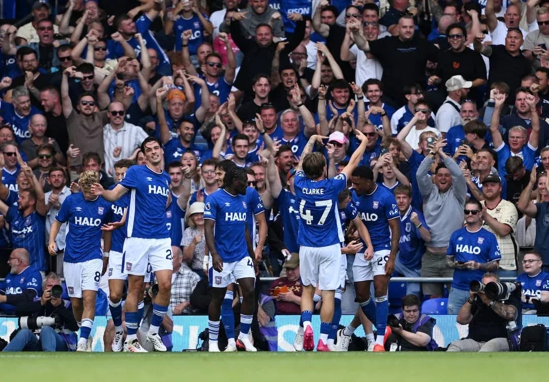 Ipswich players celebrating a goal with fans