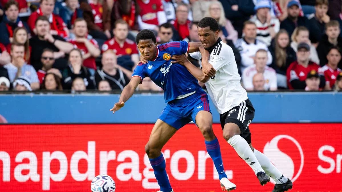 Two players battling for possession during match