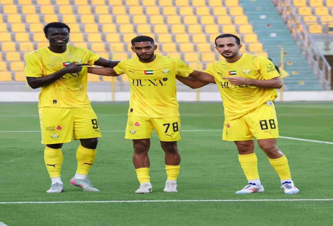 Ajman U23 players celebrating on the field