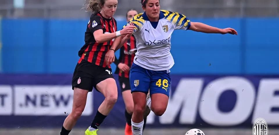 AC Milan W player competing for the ball against Parma W